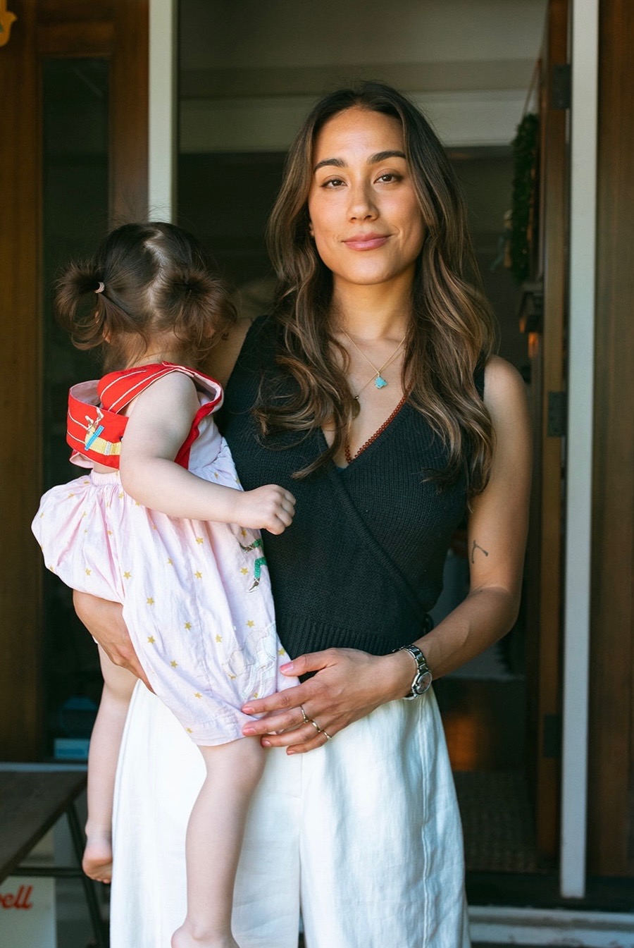 Dr. Sarah Swanson holding her child.